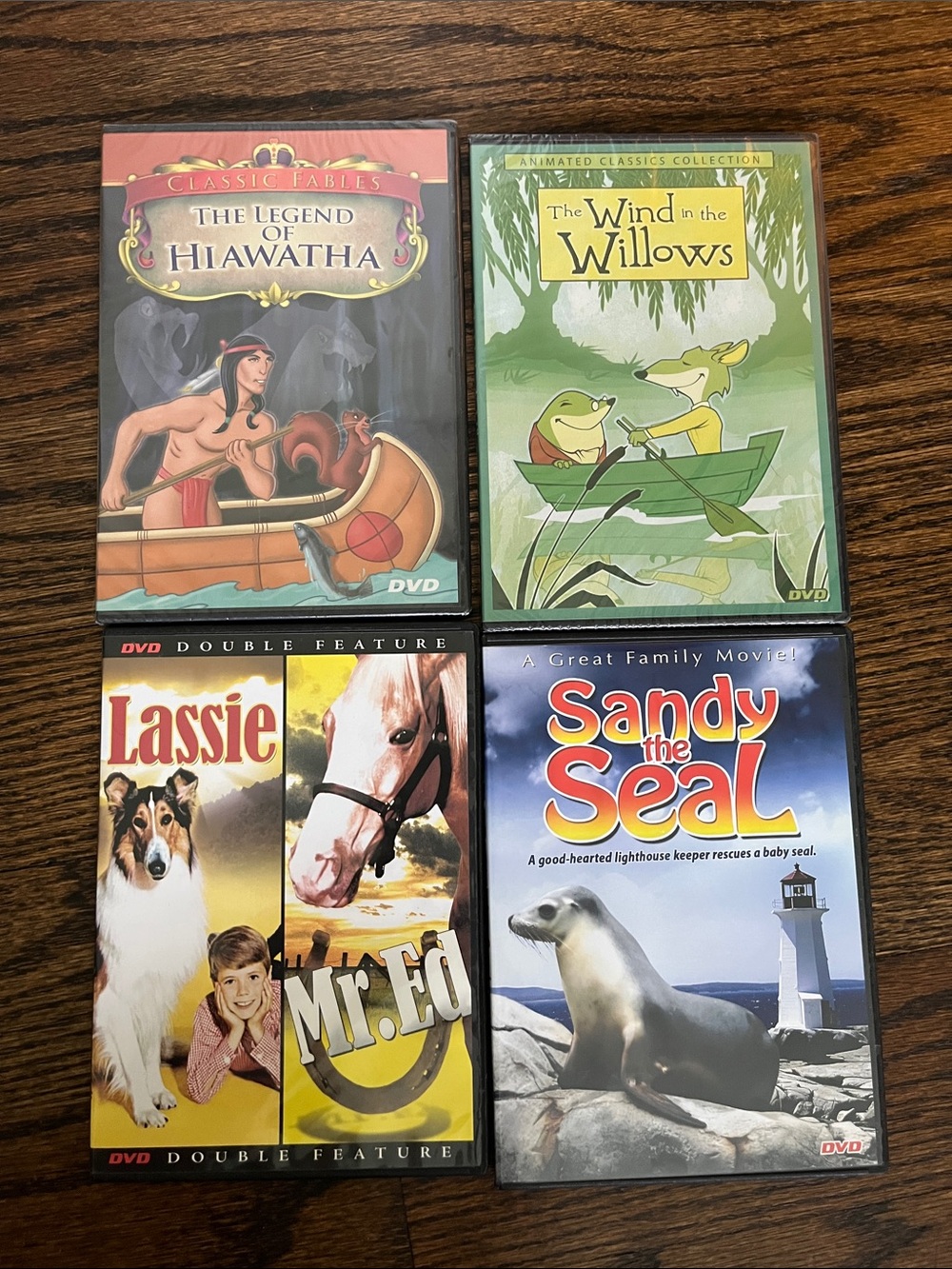 4 DVDs, Hiawatha & wind in the Willows, Mr. Ed, Lassie & Sandy the seal